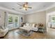 Bright living room with a ceiling fan, a comfortable sofa, and French doors to the balcony at 1204 Basildon Rd, Mount Pleasant, SC 29466