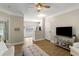 Cozy living room with a ceiling fan, comfortable furniture, and an open view into the kitchen at 1204 Basildon Rd, Mount Pleasant, SC 29466