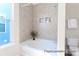 Bright bathroom with tiled shower and tub combo, neutral color palette, and built-in niche at 1233 Homecoming Blvd # Cc2-1-34, Ravenel, SC 29470