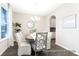 Sunlit dining area with stylish chairs, round wood table, chandelier, and view into the butler's pantry at 1233 Homecoming Blvd # Cc2-1-34, Ravenel, SC 29470