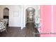 Bright entryway showcases an arched doorway, hardwood floors, and sightlines into the dining and living area at 1233 Homecoming Blvd # Cc2-1-34, Ravenel, SC 29470