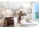 Modern kitchen boasts an island, stainless steel appliances, granite countertops, and a cozy breakfast nook at 1233 Homecoming Blvd # Cc2-1-34, Ravenel, SC 29470