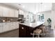 Gourmet kitchen with large island, granite countertops, stainless steel appliances, and modern lighting fixtures at 1233 Homecoming Blvd # Cc2-1-34, Ravenel, SC 29470