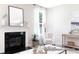 Cozy living room featuring a fireplace, comfortable seating, and stylish accents at 1233 Homecoming Blvd # Cc2-1-34, Ravenel, SC 29470