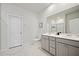 The bathroom features double vanity sinks, marble floors, and a separate toilet area for added convenience at 127 Oyster Tide Ave, Summerville, SC 29485