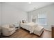Comfortable bedroom with neutral tones, natural light, and hardwood floors at 127 Oyster Tide Ave, Summerville, SC 29485