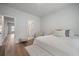 Bright bedroom with natural light, featuring a bed, chair, and hardwood floors at 127 Oyster Tide Ave, Summerville, SC 29485