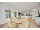 The dining area with a round table is situated near the kitchen and offers a view into the connected living space at 127 Oyster Tide Ave, Summerville, SC 29485
