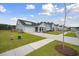 Charming home exterior with a well-manicured lawn and a two car garage at 127 Oyster Tide Ave, Summerville, SC 29485