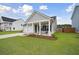 Charming single-story home with a well-manicured lawn and welcoming front porch at 127 Oyster Tide Ave, Summerville, SC 29485