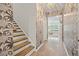 Hallway featuring stylish wallpaper, wood floors, and a staircase at 127 Oyster Tide Ave, Summerville, SC 29485