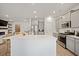 Spacious kitchen with stainless steel appliances, a large island, and ample counter space at 127 Oyster Tide Ave, Summerville, SC 29485