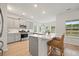 Well-equipped kitchen with stainless appliances, gray cabinets, and an island with bar seating at 127 Oyster Tide Ave, Summerville, SC 29485