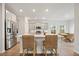 Spacious kitchen with stainless steel appliances, an island, and a dining area at 127 Oyster Tide Ave, Summerville, SC 29485
