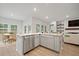 Open kitchen design with island seating that connects to the dining and living areas at 127 Oyster Tide Ave, Summerville, SC 29485