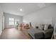 Spacious living room with hardwood floors, large windows, and comfortable seating at 127 Oyster Tide Ave, Summerville, SC 29485