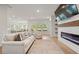 Inviting living room features a modern electric fireplace with custom shelving at 127 Oyster Tide Ave, Summerville, SC 29485