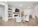 Cozy living room featuring a fireplace, built-in shelves, and stylish decor at 127 Oyster Tide Ave, Summerville, SC 29485