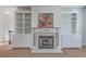 Elegant living room with a decorative fireplace and built-in shelving at 1338 Hopton Cir, Mount Pleasant, SC 29466
