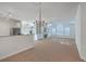 Well-lit living area featuring a chandelier, fireplace, and an adjacent kitchen at 1338 Hopton Cir, Mount Pleasant, SC 29466