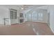 Bright living room with a cozy fireplace, built-in shelving, and lots of natural light at 1338 Hopton Cir, Mount Pleasant, SC 29466