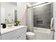 Bathroom with modern gray tile, shower and tub combo, and a sleek vanity at 136 Post Mill Dr, Summerville, SC 29485