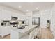 Modern kitchen with white cabinets, stainless steel appliances, granite countertops and central island at 136 Post Mill Dr, Summerville, SC 29485