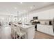 Spacious kitchen with a central island, white cabinets, stainless steel appliances, and an open floor plan at 136 Post Mill Dr, Summerville, SC 29485