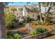Private backyard with a stone pathway, lush landscaping, mature trees, and a charming patio area for outdoor enjoyment at 1425 Lagoon Park Cir, Mount Pleasant, SC 29466