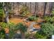 Secluded backyard featuring a charming seating area, wooden fence, and landscaped walking paths, creating a serene outdoor oasis at 1425 Lagoon Park Cir, Mount Pleasant, SC 29466