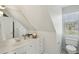 Bright bathroom with a modern vanity, a large mirror, and natural light from the window at 1425 Lagoon Park Cir, Mount Pleasant, SC 29466