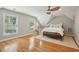 Spacious bedroom with hardwood floors, ceiling fan, and natural light from two large windows at 1425 Lagoon Park Cir, Mount Pleasant, SC 29466