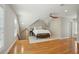 Cozy bedroom with hardwood floors, a ceiling fan, and natural light from the window at 1425 Lagoon Park Cir, Mount Pleasant, SC 29466