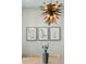 Dining area with a light fixture, artwork, and flowers for a clean decor at 1425 Lagoon Park Cir, Mount Pleasant, SC 29466