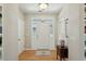 Light-filled foyer with hardwood floors, transom windows, and stylish decor at 1425 Lagoon Park Cir, Mount Pleasant, SC 29466