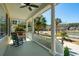 Relaxing front porch with rocking chair and outdoor seating overlooking the lawn at 1425 Lagoon Park Cir, Mount Pleasant, SC 29466