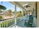 Inviting front porch with a green rocking chair and an American flag at 1425 Lagoon Park Cir, Mount Pleasant, SC 29466