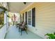 Cozy front porch features seating, a ceiling fan, and an American flag at 1425 Lagoon Park Cir, Mount Pleasant, SC 29466