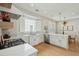 Bright kitchen with white cabinets, stainless steel appliances, and a clear view into the adjacent dining area at 1425 Lagoon Park Cir, Mount Pleasant, SC 29466