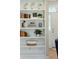 Close up of beautiful built-in shelves showing plants, books, and an open doorway at 1425 Lagoon Park Cir, Mount Pleasant, SC 29466