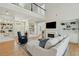 Bright living room featuring custom built-ins, a fireplace, and an open floor plan at 1425 Lagoon Park Cir, Mount Pleasant, SC 29466