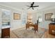 Well-lit home office featuring wainscoting, natural light, and hardwood floors at 1425 Lagoon Park Cir, Mount Pleasant, SC 29466