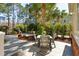 Landscaped backyard patio with an outdoor dining set and lush greenery, great for outdoor living at 1425 Lagoon Park Cir, Mount Pleasant, SC 29466