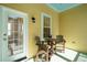 Charming yellow porch featuring an outdoor seating area, perfect for enjoying the weather at 1425 Lagoon Park Cir, Mount Pleasant, SC 29466