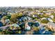 Aerial view of the neighborhood featuring charming homes, lush trees and the cityscape in the background at 146 S Battery St, Charleston, SC 29401