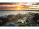 Aerial view with the sun setting over the river, showing the houses in the beautiful neighborhood at 146 S Battery St, Charleston, SC 29401