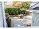 Secluded backyard with a stone patio, outdoor seating, and lush landscaping at 146 S Battery St, Charleston, SC 29401