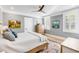 Comfortable bedroom featuring neutral walls, plantation shutters, hardwood floors, and a ceiling fan at 146 S Battery St, Charleston, SC 29401