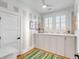 Bedroom with striped walls, storage cabinets, and natural light at 146 S Battery St, Charleston, SC 29401