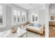 Cozy breakfast nook with shuttered windows and comfortable daybed at 146 S Battery St, Charleston, SC 29401